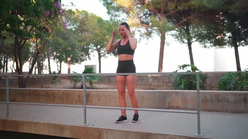 Fit Woman Exercising in the Park