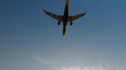 Jet airliner landing on runway.