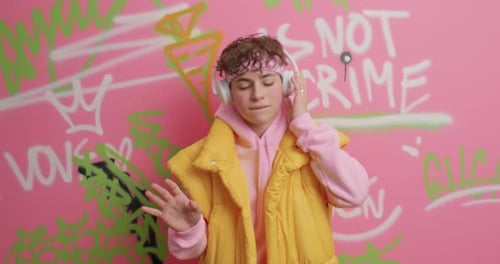 Teen Boy with Headphones Dancing to Music