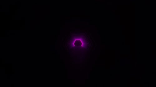 Person Walking Through Dark Tunnel