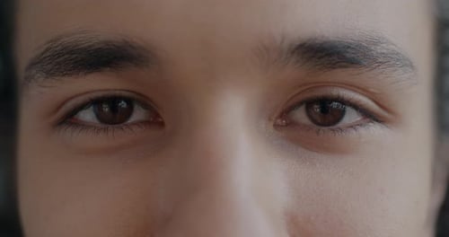 Person's Brown Eyes Opening and Closing in Close-Up