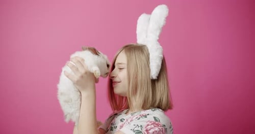 Girl with Bunny Noses Touching in Studio