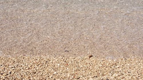 Slow Motion Sea Waves Washing Pebble Beach
