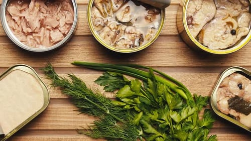 Canned Fish Assortment with Fresh Herbs Overhead