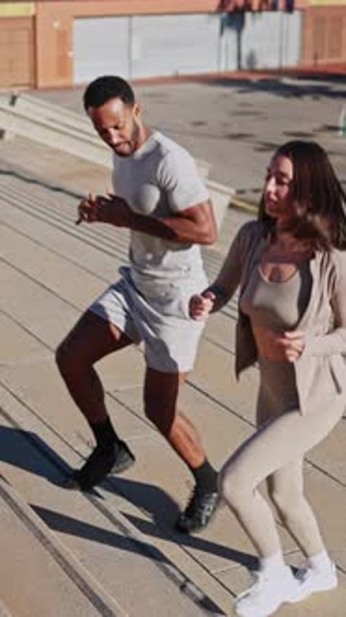 Personal Trainer Guiding Woman During Outdoor Exercise