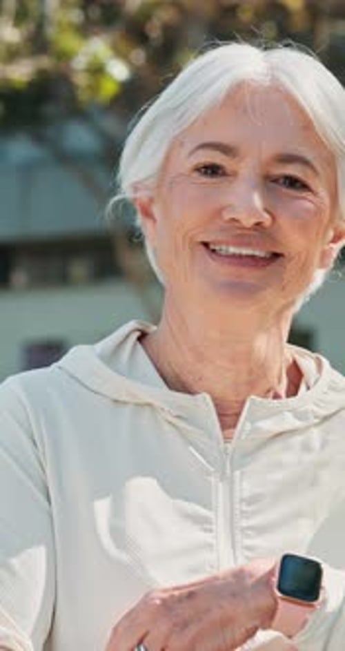 Face, fitness and mature woman with arms crossed, park and smile with sportswear on break