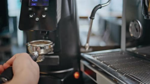 Coffee Beans Grinding Into Metal Coffee Filter