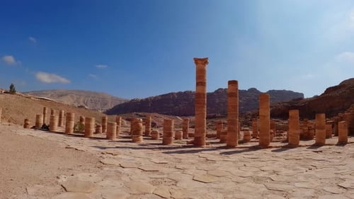 Wide angle push in to remnant spire columns of old ancient structure in Rose City petra