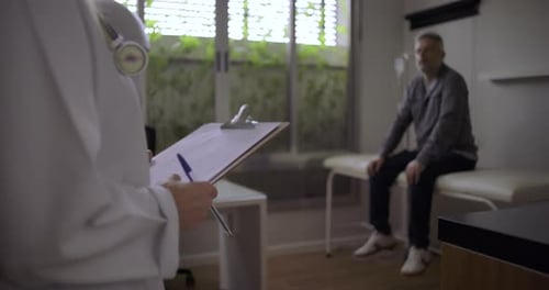 Patient with Doctor in Hospital Examination Room