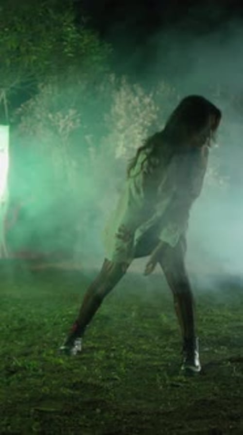 Zombie Woman Dances In An Enchanted Halloween Forest At Night
