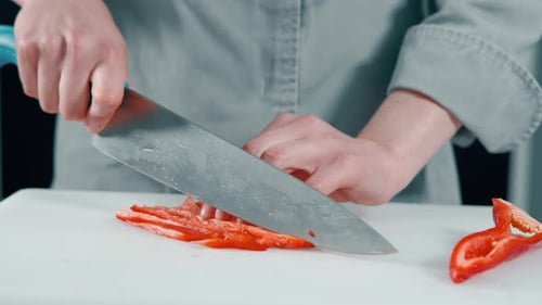 Cutting a Red Bell Pepper with a Knife