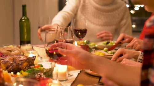 Friends Gather Around Festive Table Enjoying Holiday Feast