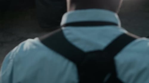 Investigator Reviewing Report with Black and White Photos