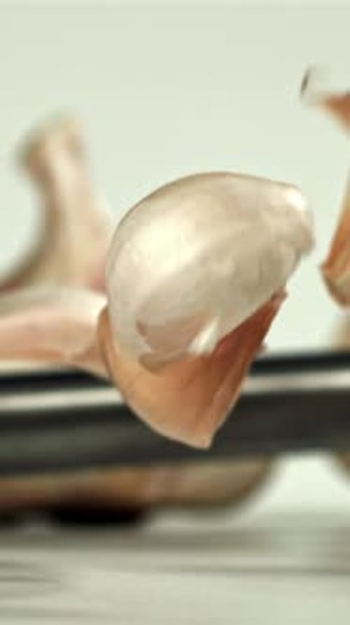 Fresh Garlic Falls on the Table Filmed on a Highspeed Camera at 1000 Fps