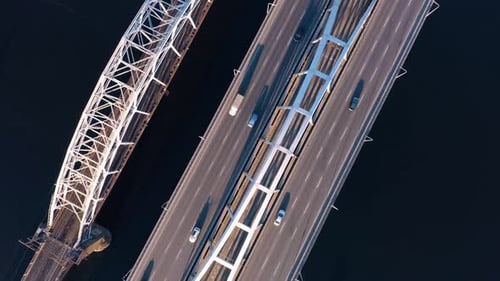 Aerial Drone View of Cars Driving on Bridge Over the River