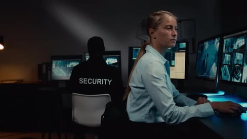 Female Security Guard Reporting Suspicious Situation on Premises to Patrol