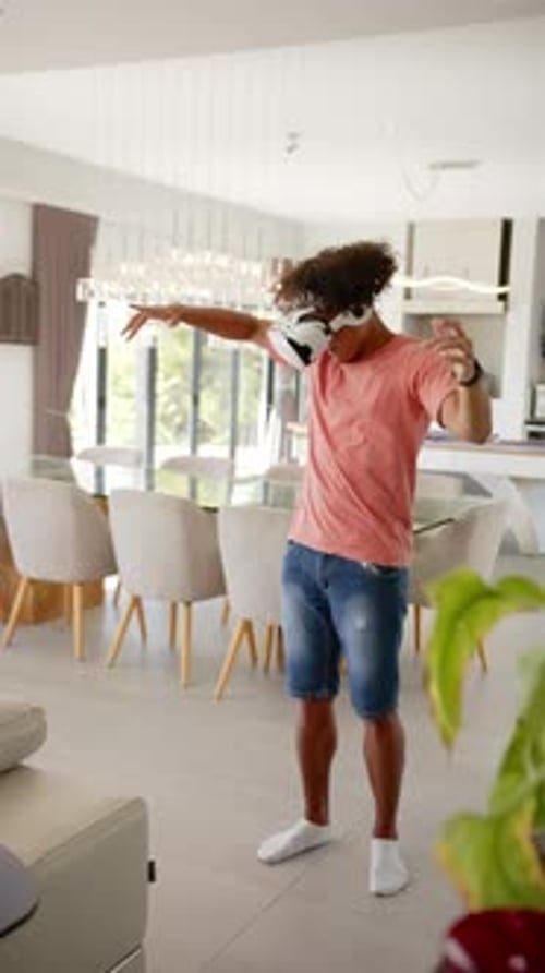 Young Adult Male Uses Virtual Reality Headset