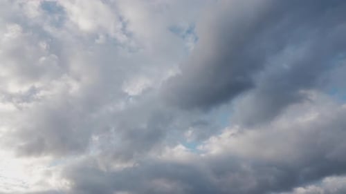 Clouds Drifting Across a Blue Sky