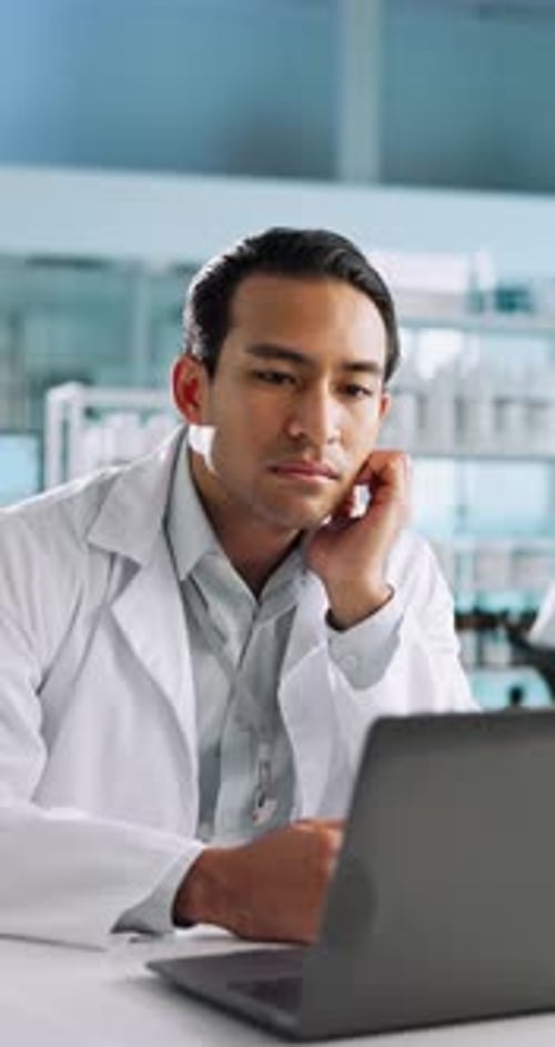 Science, thinking and man in laboratory with laptop for research, development or tired in clinic