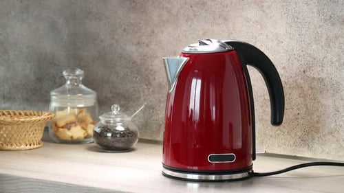 Red Electric Kettle on a Kitchen Countertop