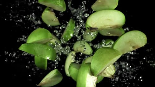 Pieces of Green Apples Fly Up and Fall Down Filmed on a Highspeed Camera at 1000 Fps