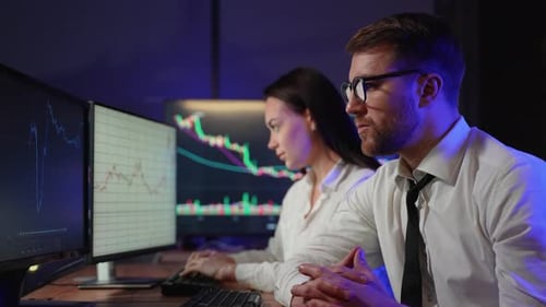 Creative Team of Cryptocurrency Traders Analyzing Bitcoin Graphs Growth and Drop in Cryptocurrencies