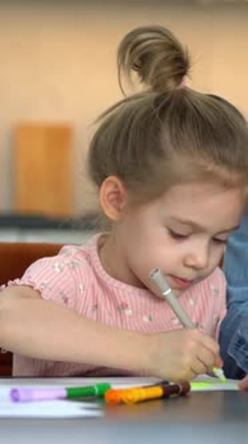 Dad and Daughter Drawing Together at Home