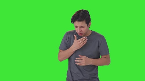 Indian man suffering from cold and cough Green screen