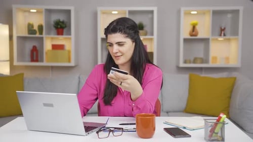 Home office worker woman doing online shopping.