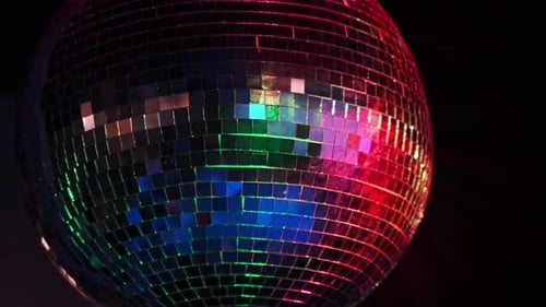 Spinning Mirror Ball Reflecting Colorful Lights