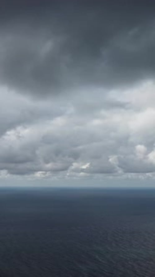 Aerial Vertical View Dramatic Moody and Gloomy Rain Clouds Over Sea Abstract Aerial Nature Summer