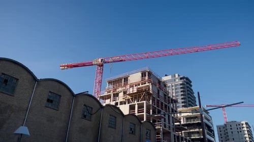 Construction Crane Building New Structures in Urban Setting