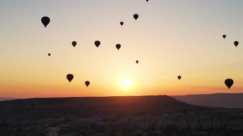 Orange Sun And Air Balloons Background. Sun Rise With Balloons In Turkey