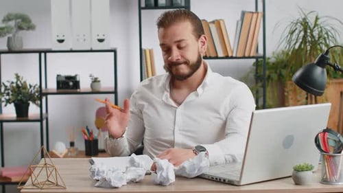 Angry Furious Man Working at Home Office Throwing Crumpled Paper Having Nervous Breakdown at Work