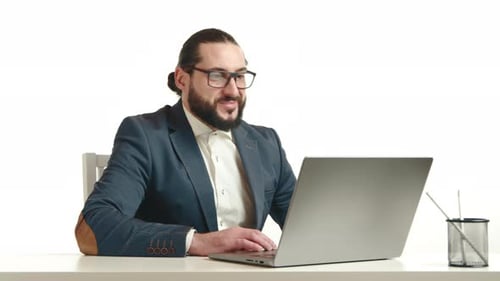 Man with Laptop talking in office