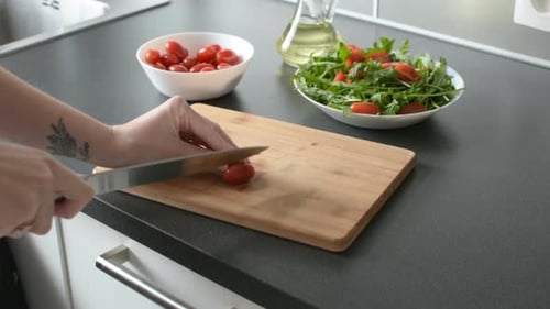 Halving Cherry Tomatoes for a Salad