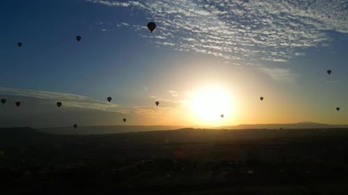Hot Air Balloons at Sunrise in Cappadocia Landscape