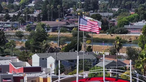 United States and California Flags in Suburban Scene