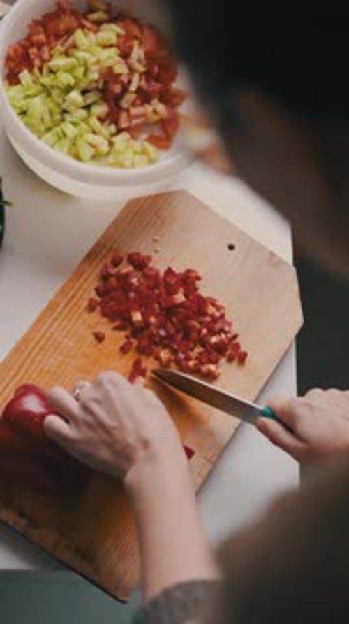 Woman Dicing Bell Pepper for Salad Preparation