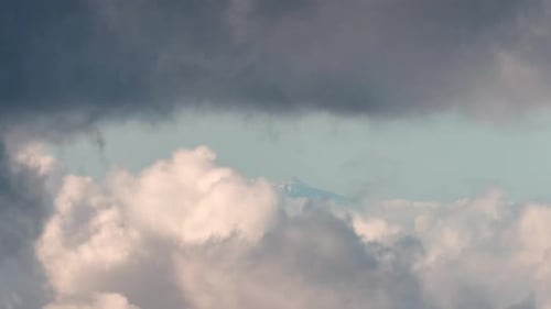 View of Mount Teide covered by snow. Seen from Gran Canaria on a Cloudy winter day