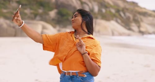Woman, beach selfie and peace sign with funny face, happiness and outdoor for social media post