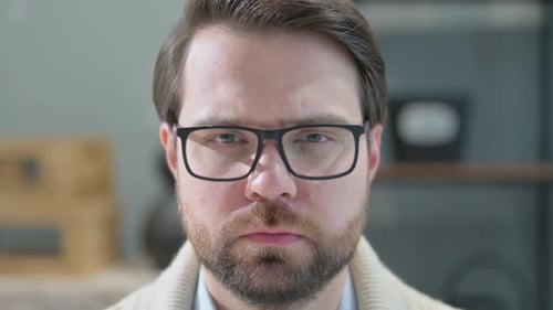 Close up of Serious Mature Adult Man at Home