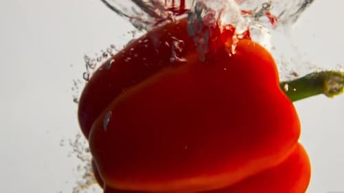 Bell Peppers Dropping Into Water in Slow Motion
