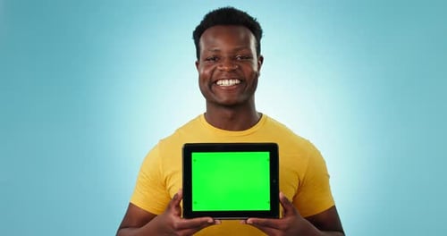 Face, man and green screen space on tablet in studio for advertising, review