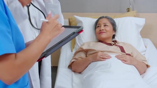 Senior Patient Relaxing in Hospital Bed