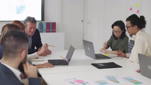 Diverse Professionals Collaborating at a Corporate Meeting