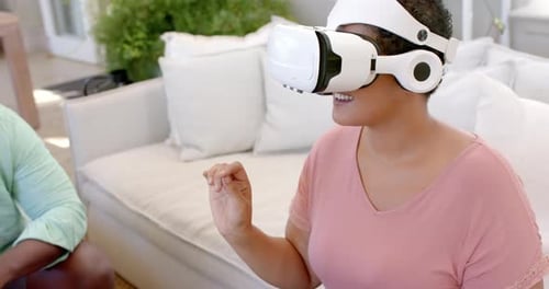 Woman Using Virtual Reality Headset in Home