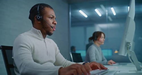 Call Center Office African American Technical Support Specialist Provides Online Customer Service