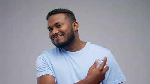 Happy Groomed Man with Perfume Scent