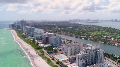 Miami beach aerial drone flyover captures summer vacation views over turquoise ocean